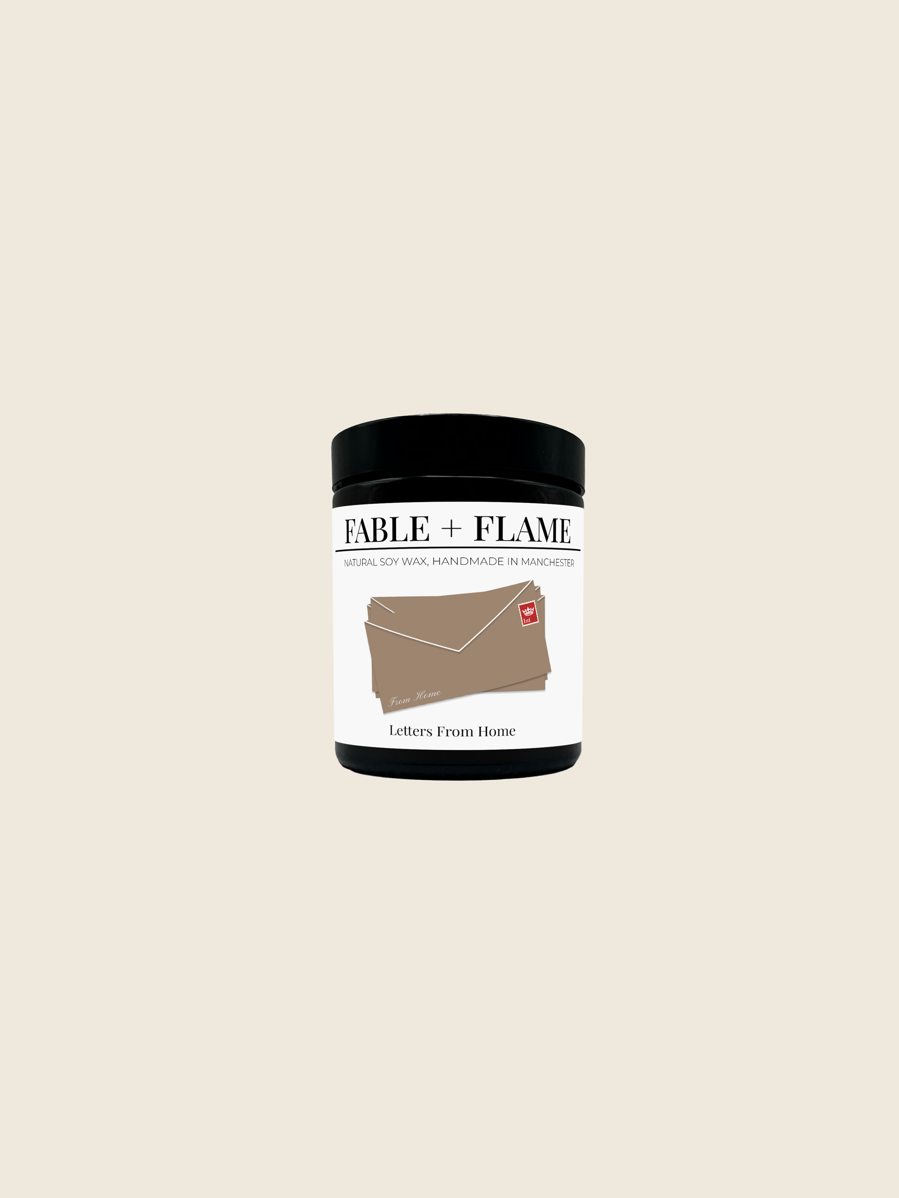 Fable and Flame Candle on a beige background in the scent 'Letters From Home'