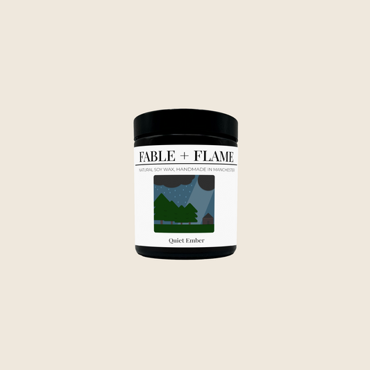 Fable + Flame candle scented 'Quiet Ember' on a cream background